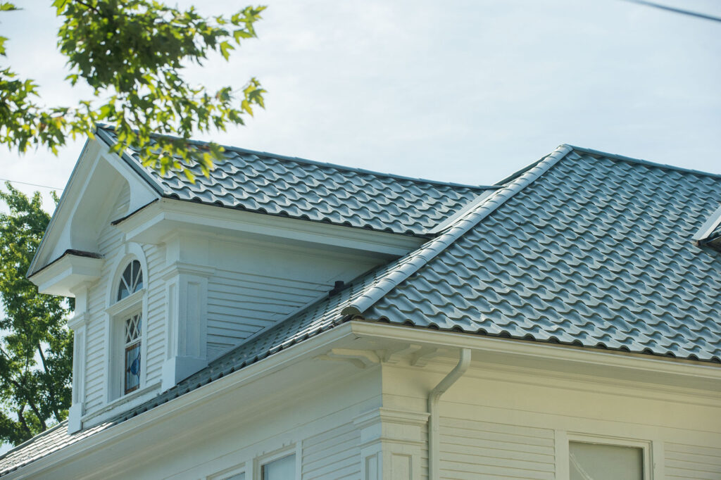 ProVia metal slate roofing on a white Ohio home